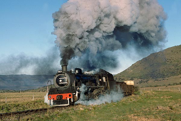 South African Railways class 19D 4-8-2 2722 leaving Sterkstroom