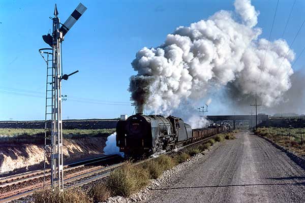 South African Railways class 25 4-8-4 3468 leaves Orange River
